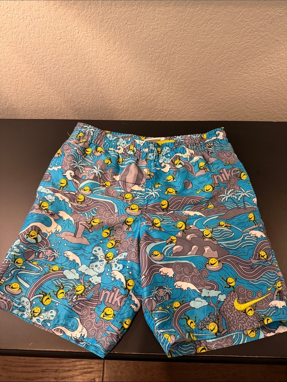 Nike Kids Turquoise Graphic Swim Trunks with Yellow Smiley Accents